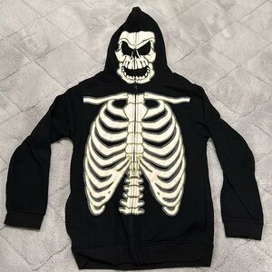 Boy’s XL glow-in-the-dark skeleton hoodie. Hood zips all the way closed.